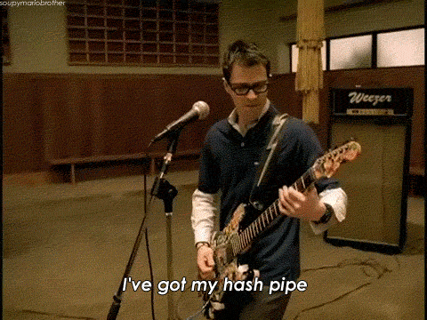 Gif of Weezer's lead singer singing into a microphone saying 'I've got my hashpipe'